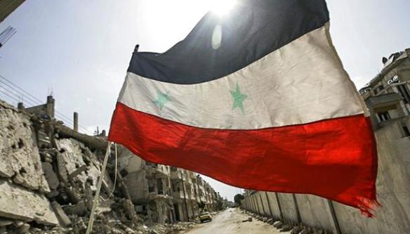 A Syrian flag in Homs